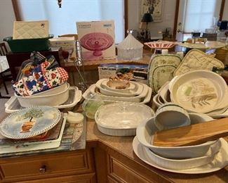 Many cake plates on pedestal, corning ware, so many dishes and bowls.
