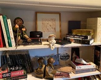 One of many bookshelves filled with interesting items. Interesting reading on so many topics