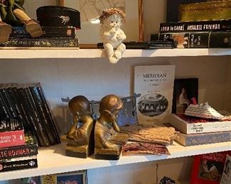 A great book on Meridian sits on the bedroom bookshelf amongst collectibles and other items