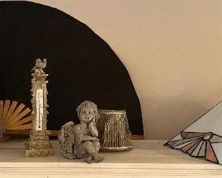 Paper mache goose. And a stained or leased glass lamp