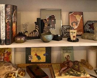 What a curiosity cabinet - a pottery horse. Zebra bookends. Georgia Okeefe book and DVD. Much much more
