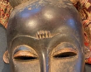 another hard wood African mask. Life size and has been worn in the past.