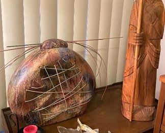 interesting pieces of art- a carved shepherd. old art deco glass tie backs. a one of a kind vase