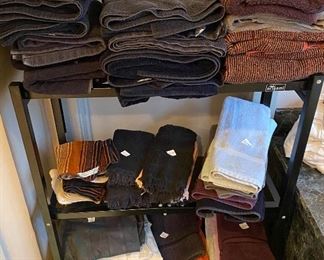 lots of bath towels and bath accessories in the well stocked master bath