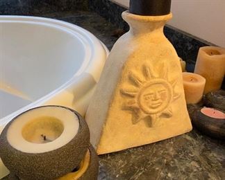 items alongside the over sized tub include a nice collection of candles