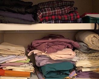 stacks of colorful sheets for your beds. most are full/double.