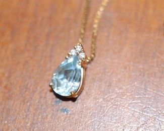 Large Aquamarine in gold setting with gold chain