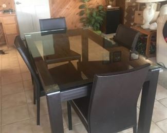 Glass table 5’X3’ and four chairs