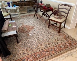 Oriental rug, leather top side tables on casters