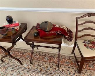 Leather top side tables on casters, needlepoint chair, etc.