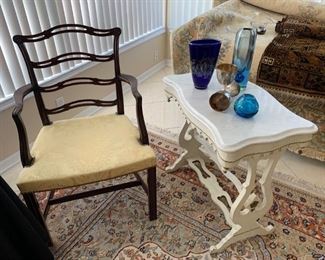 White marble top side table, vintage arm chair