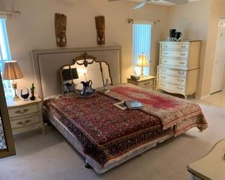 Contemporary upholstered king headboard with nailhead trim, Oriental rugs, etc.