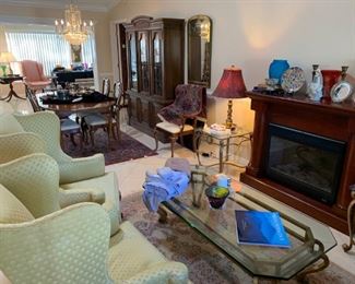 Electric fireplace, brass & glass coffee table & end tables, Stiffel table lamps, Drexel hutch, Thomasville dining room table, leaf, pads, 2 arm & 4 side chairs.