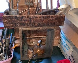 Love these primitive boxes & yard tools!