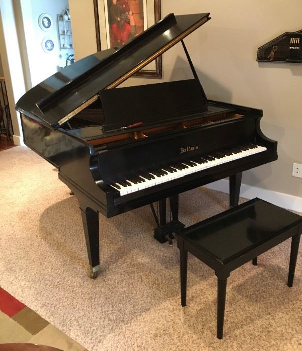 BABY GRAND PIANO.  Beautiful eight foot Baldwin baby grand piano and bench.   (W  65”, H 37”, D 56”) About 65 years old, seasoned and played often.  Has a softer, gentler action which makes it easy to play and gives it a beautifully rich sound.  Was tuned about six months ago. Recently appraised at $5,000.  Sell for $3,300. Comes with tuning fork.  CASH ONLY.