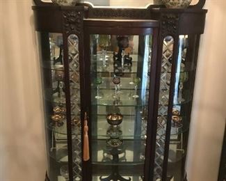 Antique Bow Front China Cabinet: Very Unique Piece in Mahogany with Leaded Glass, Mirror, and Claw Feet. Circa Late 1800s. 