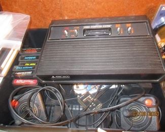 Atari 2600 system with games including Pac-Man & Space Invaders