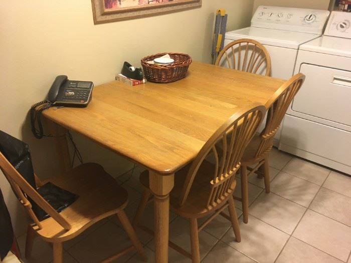 This is a nice solid oak kitchen table and four chairs -- good quality.