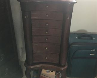 This is a cute jewelry armoire featuring Queen Anne legs -- has a slight blemish on top that can be touched up easily.