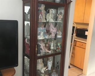 This is a beautiful curio cabinet that lights up -- great for any collectibles -- retailed for over $1,100.00!