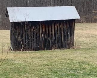 Antique cedar building in need of tear down, removal and repurposing