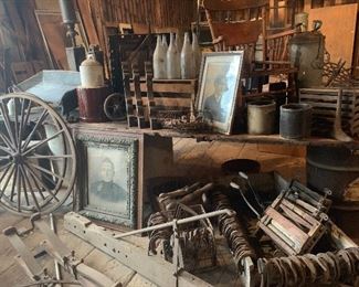 Antique Victorian frames, old horseshoes, wringers for old washing tubs, old crocks, early egg crate, antique wine and beer bottles, antique corbels, buckboard wagon seat, early wood cobbler boot molds