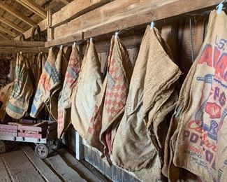 Loads of vintage feed/dry good sacks, vintage wagon