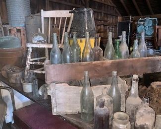 Antique chairs, early glass bottles, apothecary bottles, old wood boxes, enamelware, galvanized tin coolers, old trunks, vintage fans