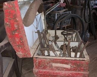 Antique Victorian humpback traveling trunk with misc old bicycle parts