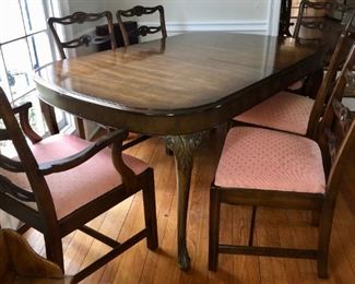 Lovely dining room table about 66” long plus 3 leaves; 2 cushioned armchairs, 4 matching side chairs