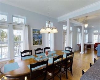 Dining room table with 8 chairs, and wall art