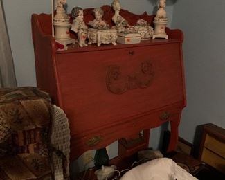 Antiqued red lady's desk featuring Corday collection