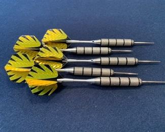Metal tipped darts with board. 