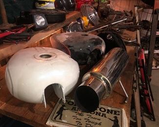 Two Harley gas tanks and one Indian gas tank