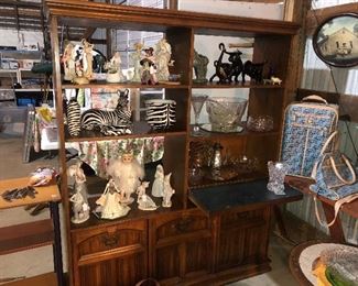 Various glass and ceramic collectibles in a beautiful oak display cabinet