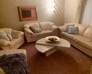 Leather “over stuffed” sofa, love seat, chair and ottoman.