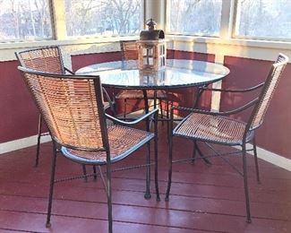 Wrought iron patio table w/glass top and 4 matching chairs