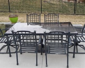 Hampton Bay-Patio set six chairs two swivel with custom cushions and tempered glass top. Just in time for your party on the patio!