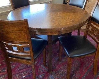 Contemporary wood table and 4 chairs. Bought new 2 years ago from Brown's Furniture ($450) - asking $250, does have some minor flaws on seats from cat but will throw in 4 new seat covers.