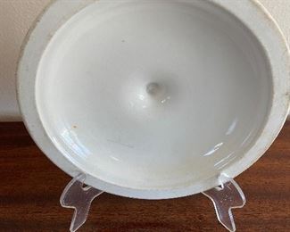 Back side of Flying Crow dinnerware lid