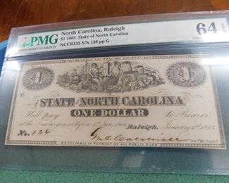 Lot 122. 1863 State of N.C. One Dollar Note(PMG 64 Choice Unc.)