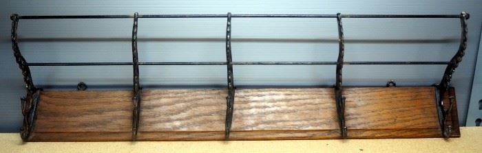 Wall Hanging Rack With Cast Iron Hooks And Rods To Hold Items On Top