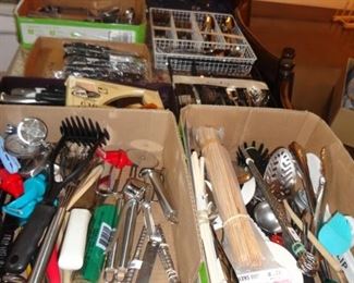 tons of silverware sets and cooking utensils and cookie cutters 