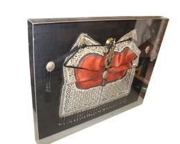 Asian saddle in a shadowbox frame