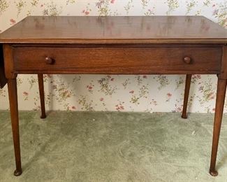 Walnut Dressing Table with Single Full Length Drawer and Overhanging drop leaf	29x58x20	HxWxD
