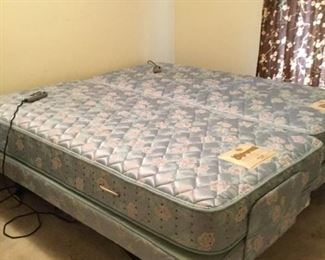 Dual control bed with massage and ability to raise and lower head and legs.