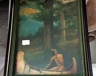 Antique picture of Indian rowing a canoe