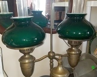 Antique brass double student lamp with green cased shades (white interior)