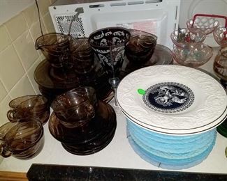 Wedgewood white and black plates. Fostoria cinnamon brown Horizon glass dishes.