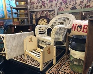 Wicker Chair and Table.  2 older ladder back chairs, Painted milk can.  Toy Doll bead.  Windows ready for your imagination.